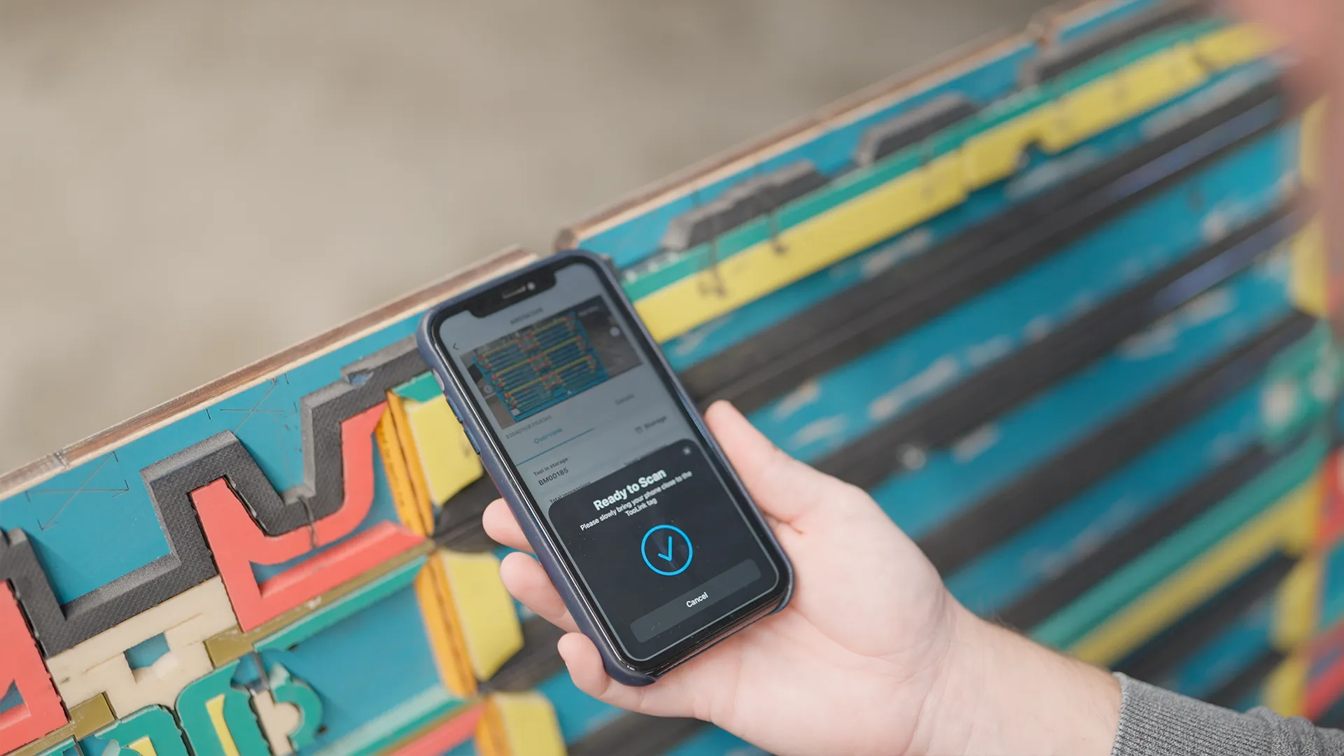 Smartphone scanning a cutting die tag with the BOBST TooLink digital solution
