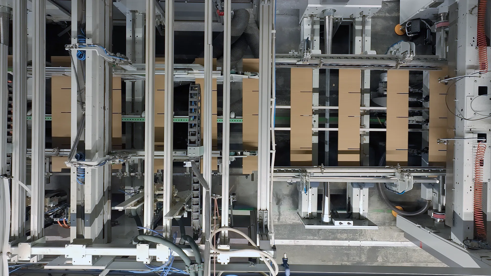 Top-down shot of corrugated boxes moving along the line