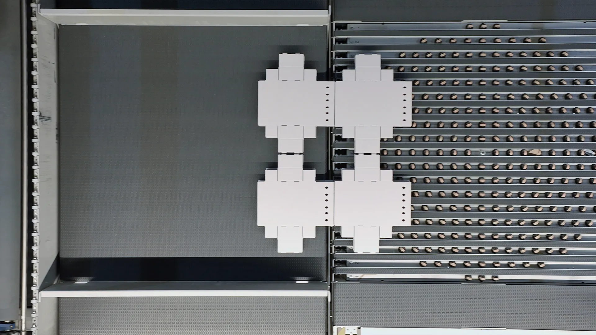 Top-down shot of die-cut blanks on the conveyor of the BOBST MASTERCUTLINE